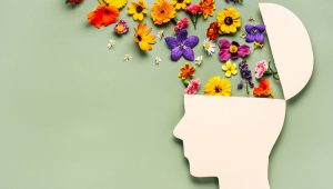 Depicting mental health with flowers coming out of the mind