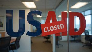 US AID sign over entrance marked "CLOSED"