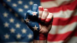 Raised fist painted with American flag symbolizing unity between political parties on national security and Iran policy.